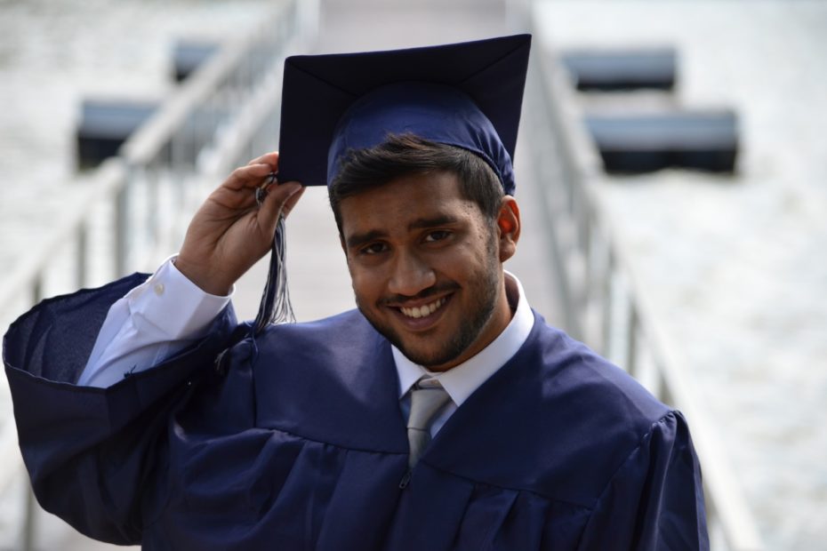 man holding his graduation cap
